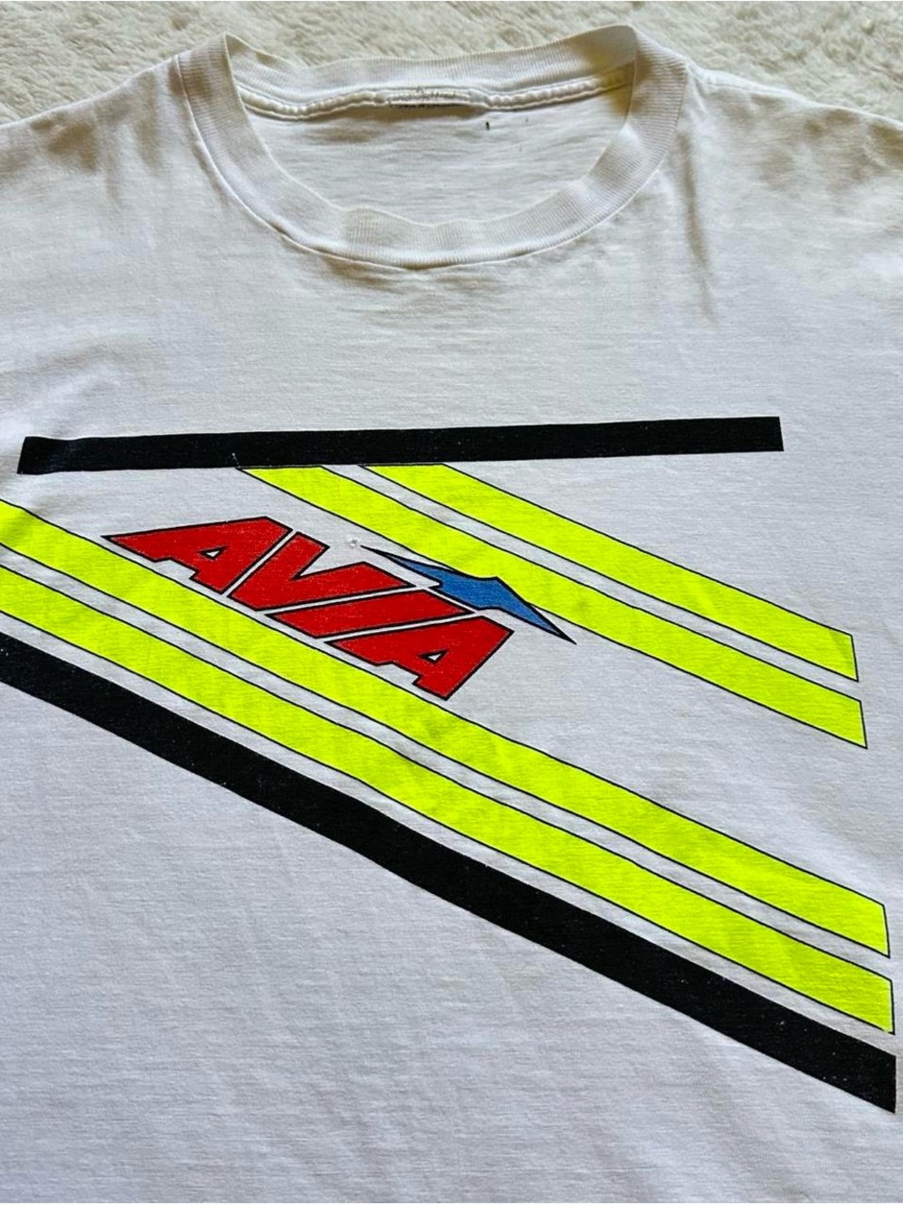 Vintage 1990s Avia Graphic Tee in White with Red & Neon Yellow Logo men’s medium